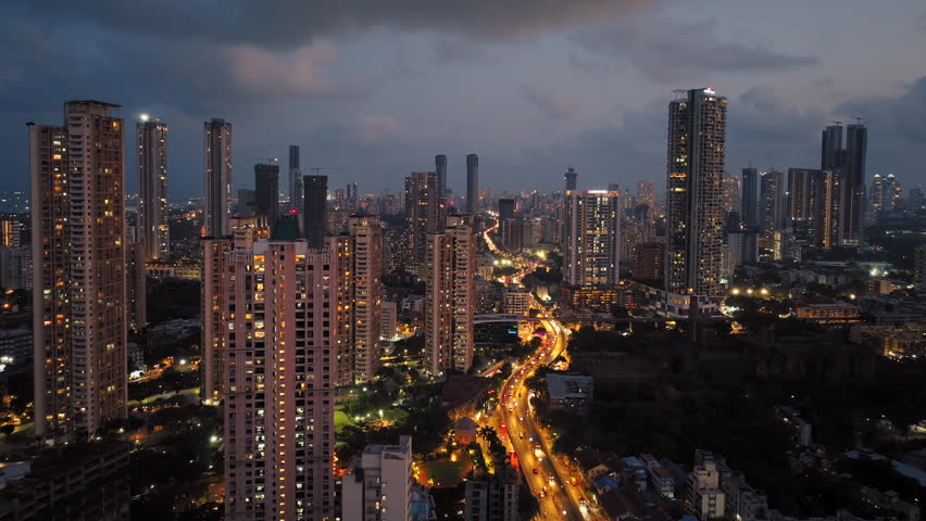 Aerial view of Mumbai city at night. Mumbai night view cityscape. Central Mumbai's cityscape and skyline- Lalbaug-Parel, Lower Parel, Worli, Curry Road, Prabhadevi. Royalty-Free Stock Footage #1104443515