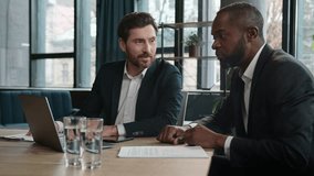 African American employer share business idea Caucasian man excited support two diverse men multiracial office coworkers businessmen meeting talking discuss laptop startup negotiate smiling laughing - Powered by Shutterstock - Get 15% off with code: PIKWIZARD15