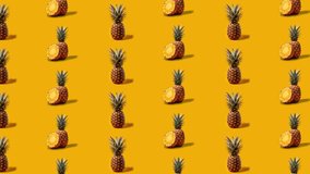 Stop motion Cut and whole Pineapple appear and disappear on orange background. High quality video 4K. Detailed stop motion video. Background or wallpaper in food and drinks videos.