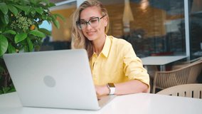 Worldwide work Female developer working on laptop sitting terrace cafe. Woman freelancer coding at outdoor restaurant use laptop close up portrait shot. Caucasian girl working remotely. Remote job - Powered by Shutterstock - Get 15% off with code: PIKWIZARD15