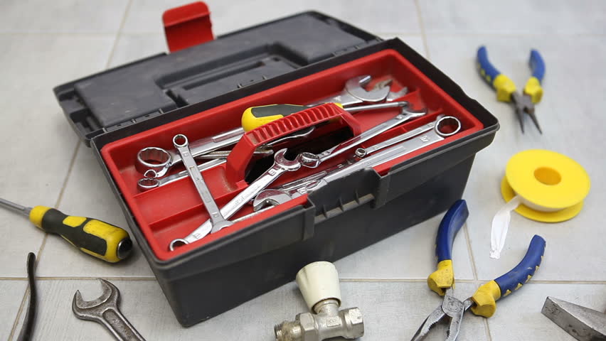 Tool box, wrenches, screwdriver and pliers are on the floor. Repair of plumbing in the apartment. Royalty-Free Stock Footage #1104453059