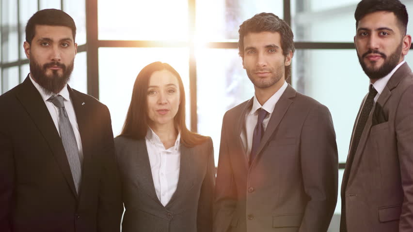 succesful business team smiling teamwork corporate office colleague