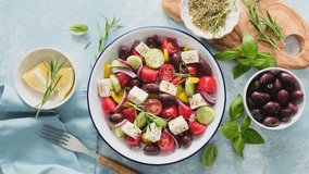 Greek salad. Vegetable salad with feta cheese, tomato, olives, cucumber, red onion and olive oil. Healthy vegetarian mediterranean diet food. Video 4k