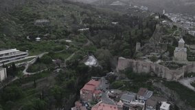 Aerial photo Drone flies above Tbilisi Georgia city center Rike park, river kura