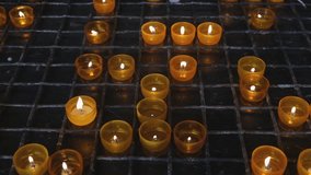 Burning round candles in a catholic church