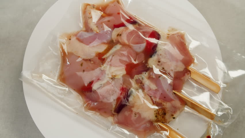 Beef, chicken and salmon tapas skewer in vacuum plastic bag ready for sous vide cooking or grill, supermarket ready to eat food. | Shutterstock HD Video #1104465847