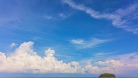 The sky was a brilliant blue, dotted with white clouds that moved gracefully across the horizon.
The wind gently blew them to and fro, seemingly without direction, 
but in a mesmerizing pattern that w