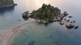 4k drone forward video (Ultra High Definition) of Bella island. Exciting spring seascape of Mediterranean sea, Mazzaro' town, Sicily, Itale, Europe. Traveling concept background.