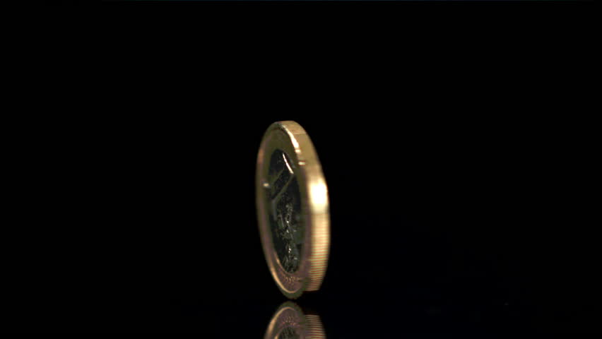 One coin spins around its axis. Filmed is slow motion 1000 fps. High quality FullHD footage Royalty-Free Stock Footage #1104476925