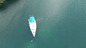 drone video of boat on clear water 