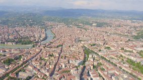 Inscription on video. Verona, Italy. Flying over the historic city center. Arena di Verona, summer. Shimmers in colors purple, Aerial View, Departure of the camera