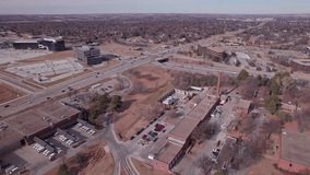 Drone shot pushing in on interstate highway crossing and overpass outside Midwestern city of Omaha, Nebraska