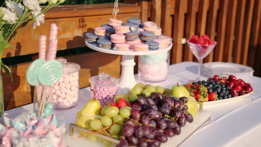  Candy Bar In The Banquet Hall. Colorful Macarons On Display Stand. Wide shot | Shutterstock HD Video #1104497545