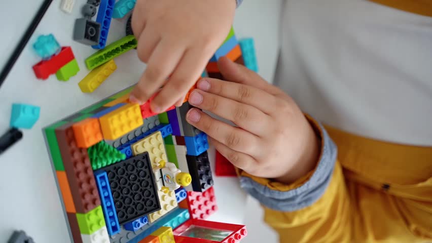 Robotics programming class. Children construct and code Robot. STEM education using constructor blocks and laptop, remote control joystick. Technology educational development for school kids. Vertical - Powered by Shutterstock - Get 15% off with code: PIKWIZARD15