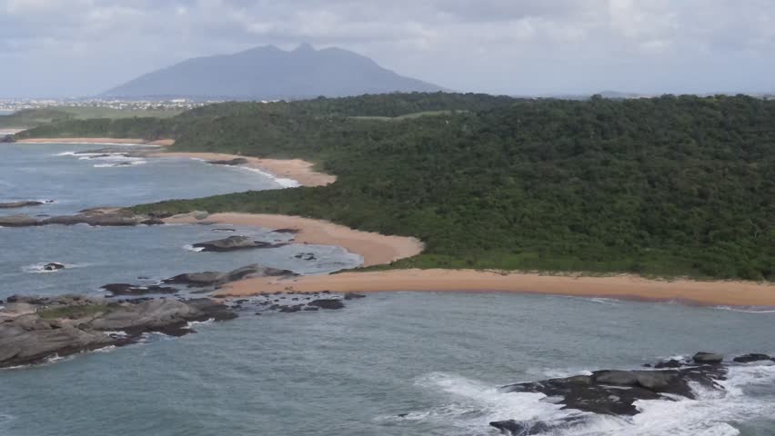 Drone-captured collection vividly showcasing Rio das Ostras' untouched beaches, bordered by majestic mountains, vibrant green farmlands, and meandering rivers, under an azure sky. Rio de Janeiro. Ocea