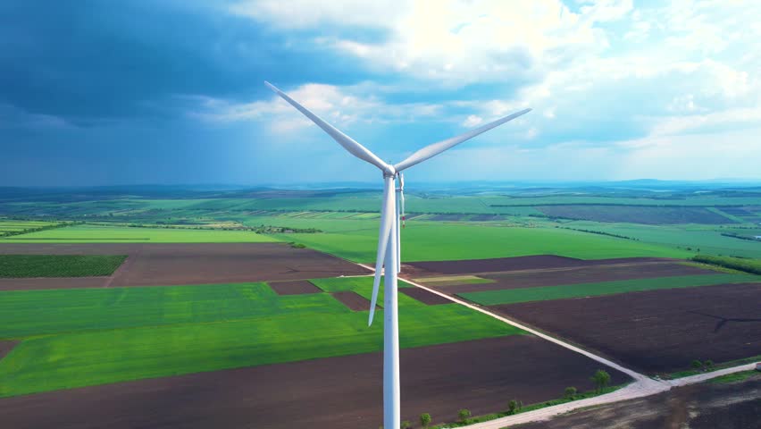Aerial view of wind turbines in summer.Windmills turbines generating green energy electric. | Shutterstock HD Video #1104508483