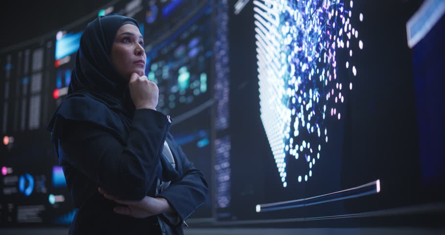 Portrait of a Smart Focused Middle Eastern Software Engineer Analyzing Neural Network Big Data on a Digital Screen. Young Arab Woman in Hijab Working in an Innovative Internet Service Company Royalty-Free Stock Footage #1104516857