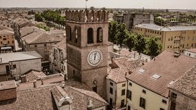 Aerial footage capturing the timeless charm of Lendinara, an ancient Italian village, showcasing rooftops and houses.