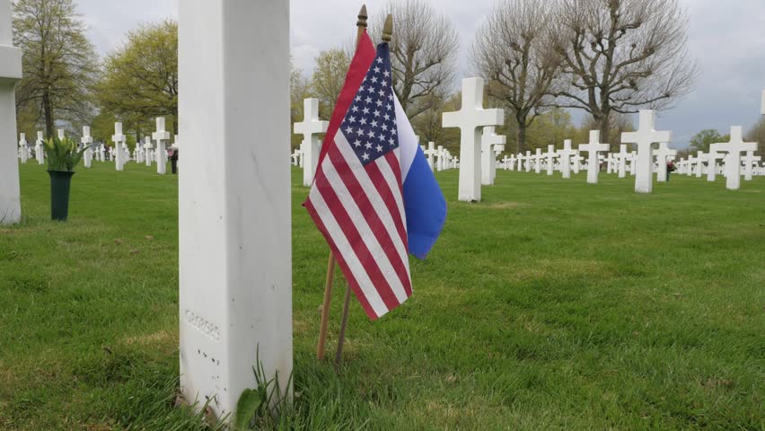 American memorial war cemetery, white cross, US and Dutch flag Royalty-Free Stock Footage #1104524703