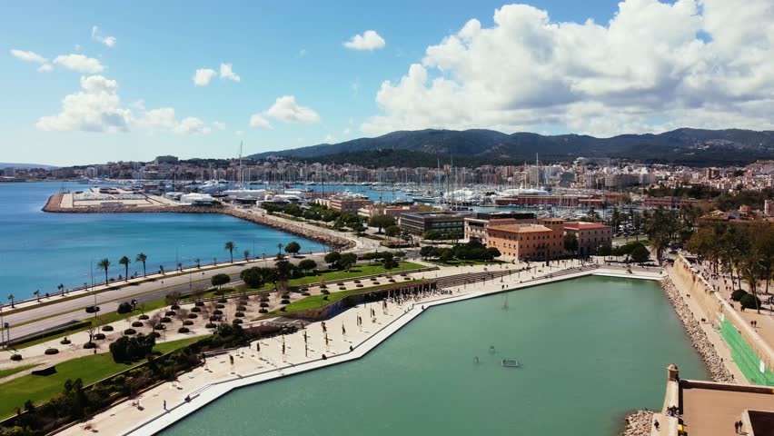 A landscape aerial view of Palma with many yachts and ships in city port marina in Mallorca