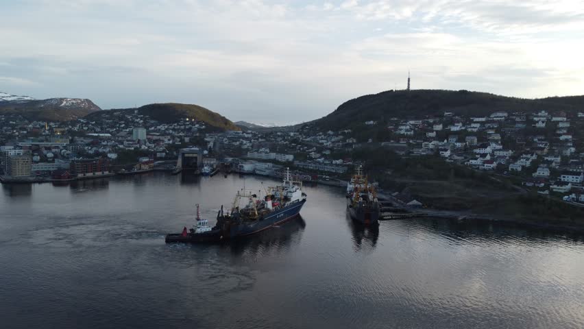 Russian fishing trawlers docking for repairs at shipyard