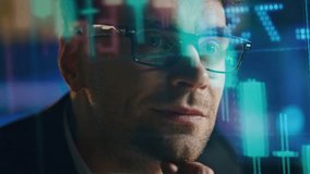 Closeup stock market analyst with economic holographic data. Smiling man trader thinking profit sales contemplating financial strategy. Professional investment manager checking hedge fund numbers. - Powered by Shutterstock - Get 15% off with code: PIKWIZARD15