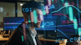 Invest manager checking stock market data in sales hologram. Busy broker working late analysing corporate financial strategy in dark office. Pensive successful man trader planning profit investment. - Powered by Shutterstock - Get 15% off with code: PIKWIZARD15