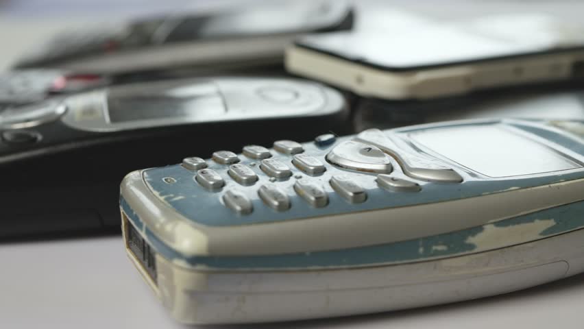 Different Types of Used Cell Phones Presentation. Old Mobile Phones, Source of Plastic and Metal Pollution. | Shutterstock HD Video #1104552053