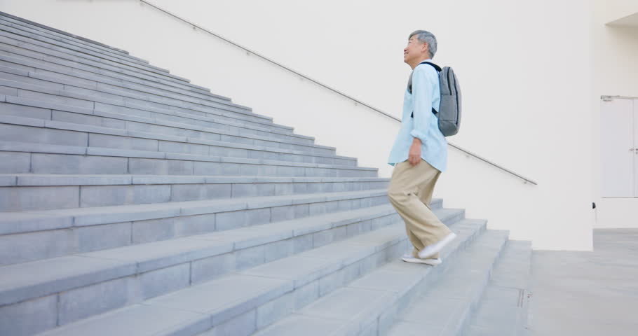 asian elderly person walking on stairs while traveling - healthy knees happy tourist free independent retirement lifestyle Royalty-Free Stock Footage #1104553977