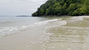 Beautiful landscape, a wave runs on the sandy shore of the sea. High quality mp4 footage. Langkawi, Malaysia 