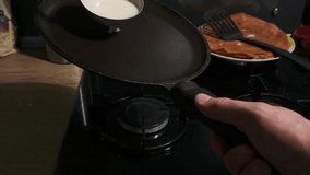 Slow motion footage of pancakes cooking process for breakfast