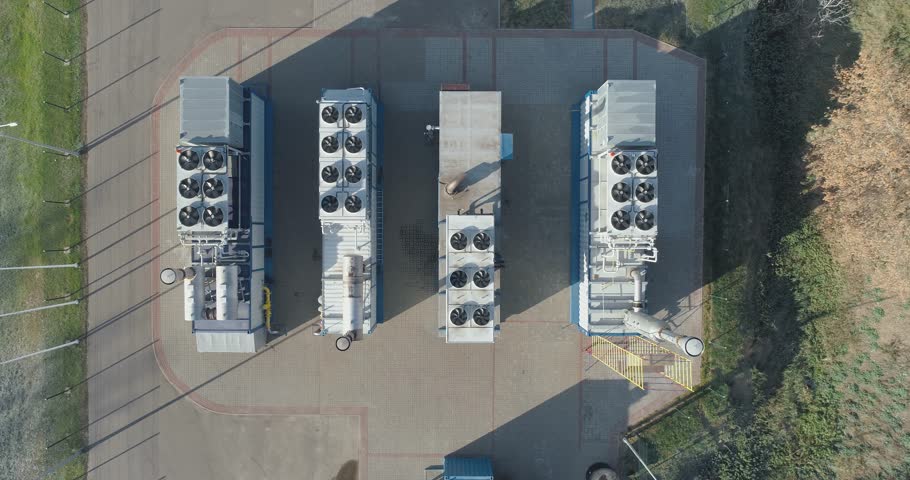 Waste recycling, view from the height of the special equipment for waste processing near garbage storage, methane extraction from garbage, rotating blades. | Shutterstock HD Video #1104556773