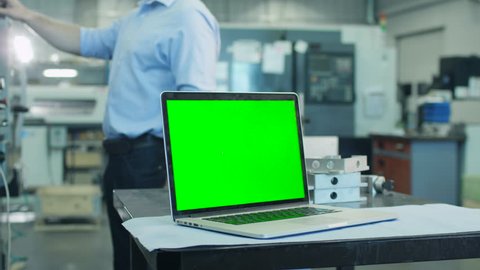 Notebook with Green Screen in Industrial Environment Mock-up. Shot on RED Cinema Camera in 4K (UHD).