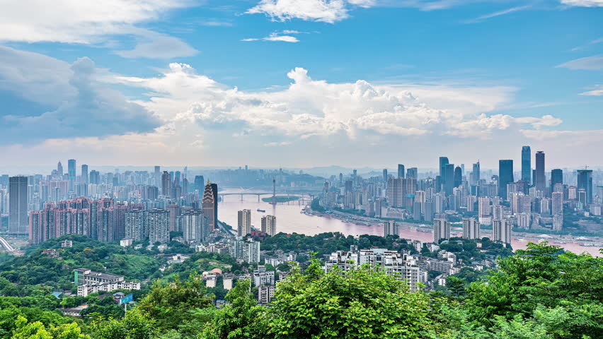 High angle time-lapse shot of city buildings skyline and river in Chongqing