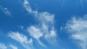 Blue sky soft silky clouds. Background of sky and clouds. Cirrus clouds in blear bright summer day. Time lapse. - Powered by Shutterstock - Get 15% off with code: PIKWIZARD15