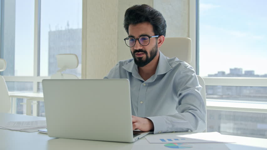 Tired Arabian Indian man businessman feel painful head eyestrain ache male ill employee overworked laptop job in office take off glasses messaging dry irritated eyes bad eyesight vision health problem Royalty-Free Stock Footage #1104591383