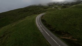 FPV aerial drone video of col de aubisque summit and twisty road in France