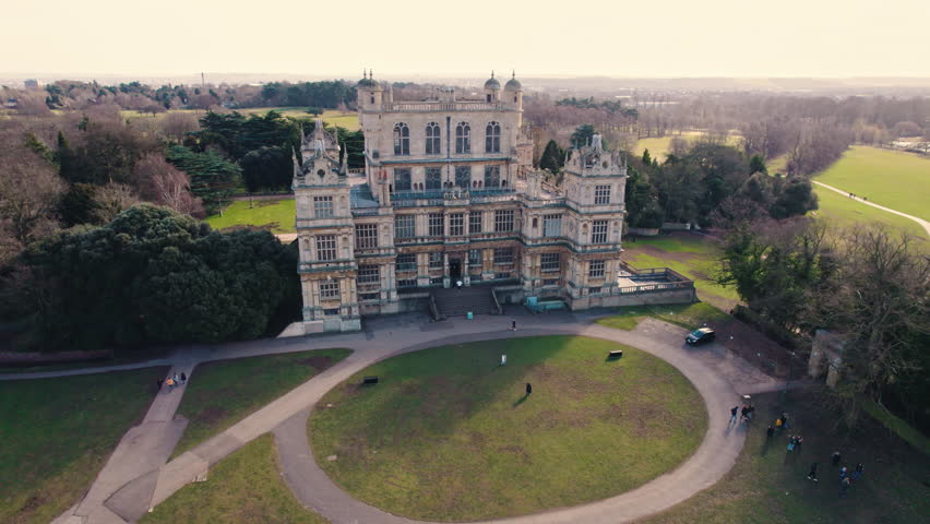 07.01.2021 Nottingham, England. Panoramic drone view of stunning Grade I listed Elizabethan mansion - Wollaton Hall - standing on prominent hill in Wollaton Park. High quality 4k footage