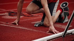 Hands of athlete in low start position close up. Runner starting on lane. Athlete starting competition. Hand touch running track close up. Fingers of sportsman on running track low start position - Powered by Shutterstock - Get 15% off with code: PIKWIZARD15