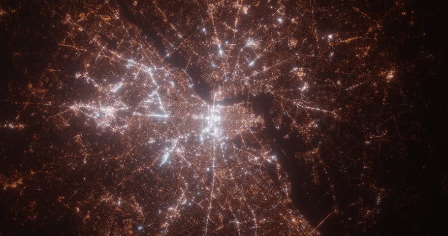Philadelphia (Pennsylvania, USA) top view at night. View on modern city from satellite. Camera is zooming in, rotating counterclockwise. Vertical video. The north is on the left side
