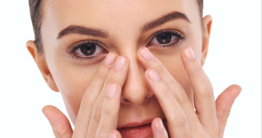 Face closeup, beauty and woman touching skin, natural skincare treatment and glow isolated on white background. Portrait, cosmetic care and female model with hands and manicure with dermatology | Shutterstock HD Video #1104599073