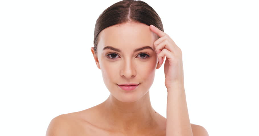 Woman touching face, beauty and skin with clean skincare and natural cosmetics isolated on white background. Female model, facial and cosmetic care glow, mockup space with dermatology and portrait | Shutterstock HD Video #1104599125