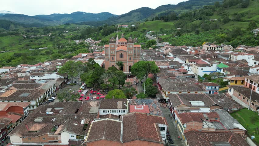 Jerico, Antioquia, Colombia. May 2023. Orbit view of two cathedrals in a little town in called Jerico.