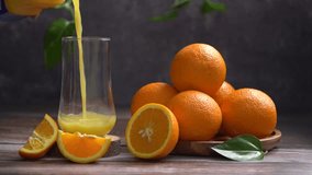 Pouring golden-orange juice into a glass, the liquid cascades gracefully, creating a thirst-quenching spectacle. - Powered by Shutterstock - Get 15% off with code: PIKWIZARD15