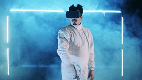 Male fencer is using a VR-device while training. Virtual reality, augmented reality game concept.
