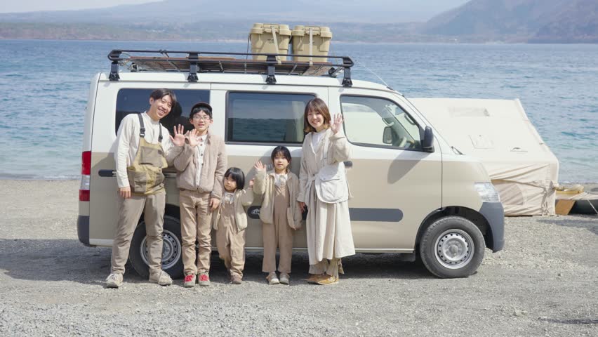 Family and camper enjoying the outdoors Royalty-Free Stock Footage #1104605689