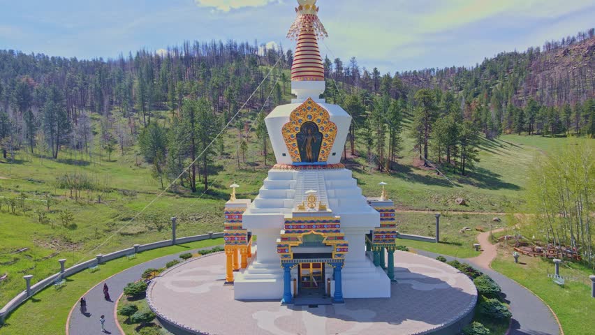 Unveiling serenity: Witness the gradual reveal of the Great Stupa of Dharmakaya's breathtaking location