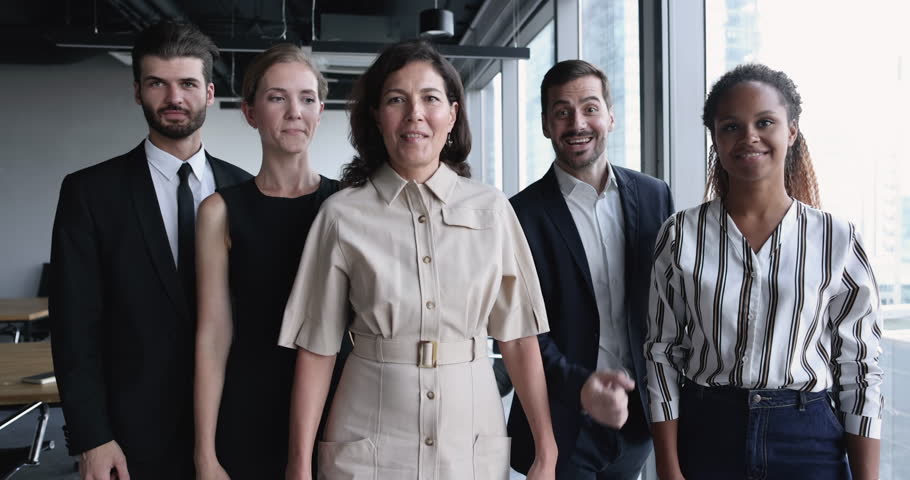 Group of happy millennial and mature employees celebrate professional success, gesturing feels overjoyed look at camera at workplace, got unbelievable opportunities, career or sales growth, promotion Royalty-Free Stock Footage #1104612335