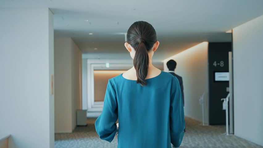 Woman walking in lobby with and digital transfomrmation concept. System engineering. Communication network. ERP. Enterprise Resources. Royalty-Free Stock Footage #1104621137