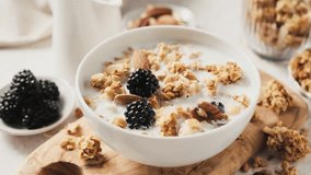 Sweet oatmeal granola with yogurt, nuts and berries